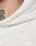 Close-up of a person in the LIVE FAST DIE YOUNG Basic Hooded Zip, Oversize Fit, light gray color, showing fabric texture, a glimpse of their neck, and part of a black tattoo.