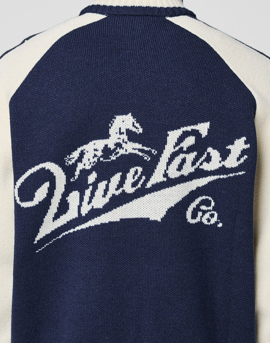 Navy blue and white Boxy Knit Zip Jacket by LIVE FAST DIE YOUNG, featuring raglan sleeves and a horse and rider graphic above stylized "Live Fast Co." logo detail on the back.
