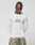 A person models the LFDY Performance Slim Longsleeve by LIVE FAST DIE YOUNG, featuring a white slim fit with mesh insert and the number 40 on the front, paired with green camo pants against a plain light background.