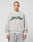 A person with a shaved head models the LIVE FAST DIE YOUNG LFDY Script Sweater—an oversize gray sweatshirt with bold green “Live Fast” text and raglan sleeves—facing forward against a plain light gray background.