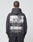A person with short hair is seen from behind wearing the LIVE FAST DIE YOUNG LFDY Cinema Hooded in Oversize Fit, featuring a bold eye graphic, the words LIVE FAST, country names, and garment details on the back.