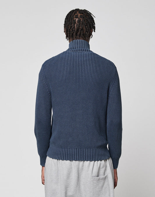 A person with short, twisted hair is seen from behind wearing the LIVE FAST DIE YOUNG LFDY Knit Jacket in blue and light gray pants against a plain light background.