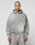 A person with a shaved head and neck tattoos models the LIVE FAST DIE YOUNG Basic Hooded Zip in gray, along with matching sweatpants, standing against a plain light background and looking at the camera.