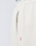 Close-up of cream-colored LFDY Heavyweight Loungepants by LIVE FAST DIE YOUNG, made from 650gsm cotton with an elastic waistband, metal zippered pocket, red fabric tag at the seam, and a white waistband with black text visible at the top.