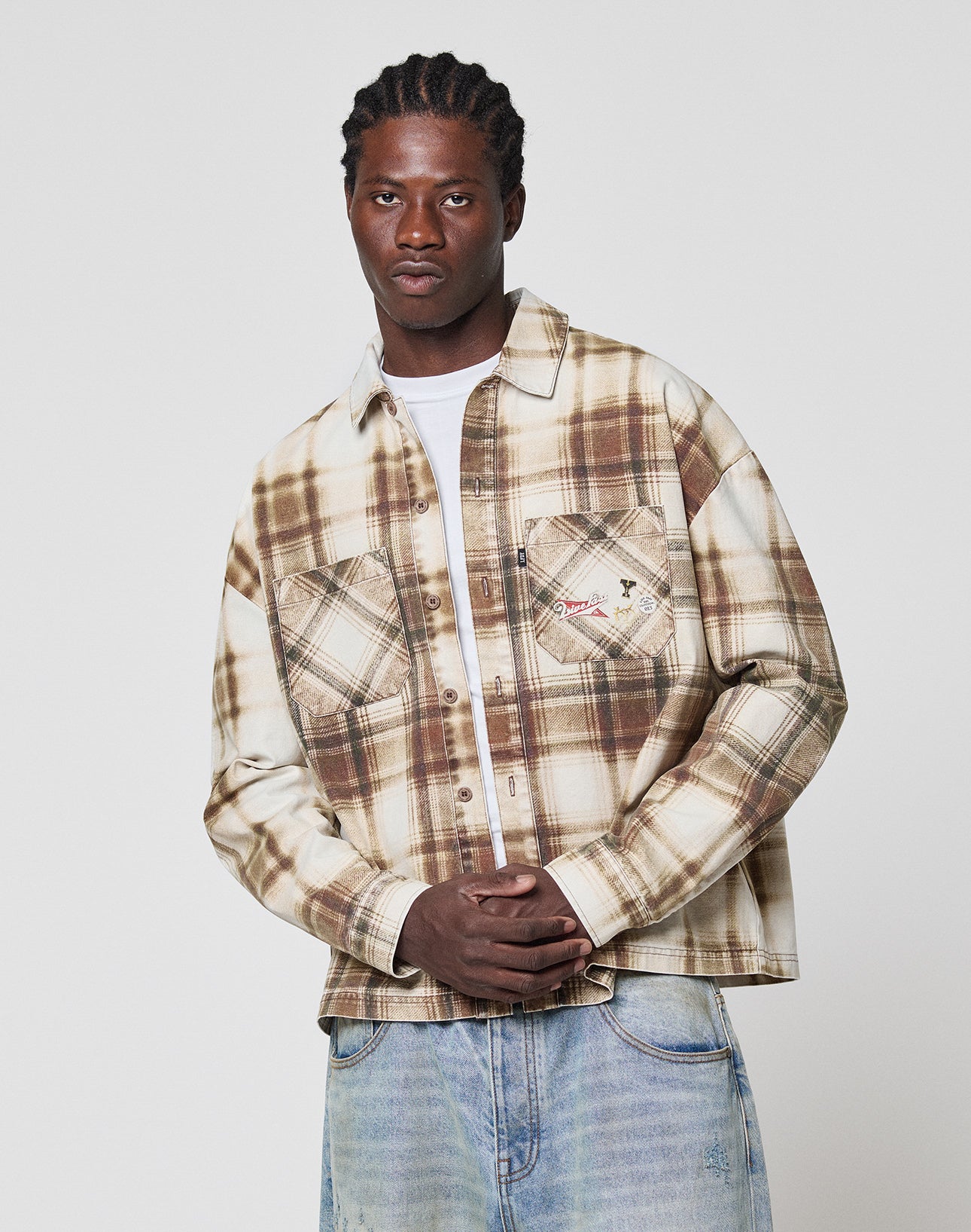 A man posing for a picture in a Faded Flannel shirt by LIVE FAST DIE YOUNG.