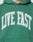 The Live Fast College Hooded by LIVE FAST DIE YOUNG is a green hoodie with LIVE FAST boldly printed in white across the chest, offering an oversized fit for comfort and standout style.