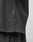 A close-up of the LFDY 40 Tee by LIVE FAST DIE YOUNG, featuring a small black AFRV tag on the seam. Crafted from soft, slightly textured 100% Baumwolle in an Oversize Fit, worn over matching black pants.