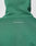 A close-up of the backprint on the Live Fast College Hooded by LIVE FAST DIE YOUNG, an oversize fit green hoodie featuring white IM JUST A KID WITH A DREAM text on the hood and upper back.