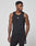 A man models the LIVE FAST DIE YOUNG Live Fast Performance Tank, a slim fit black sleeveless athletic top, with matching shorts, standing against a plain white background and looking to the side.