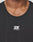 Close-up of a person wearing the black Live Fast Performance Tank by LIVE FAST DIE YOUNG, featuring a white logo and LIVE FAST in reflective print. Image shows only the neck and upper chest.