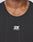 Close-up of a person wearing the black Live Fast Performance Tank by LIVE FAST DIE YOUNG, featuring a white logo and LIVE FAST in reflective print. Image shows only the neck and upper chest.