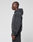 A person in profile wears the LFDY Run Club Hooded Zip by LIVE FAST DIE YOUNG, styled with matching pants. The dark gray oversize fit, soft Baumwolle-Polyester blend, and subtle Ärmelprint lend a modern touch to their casual look.