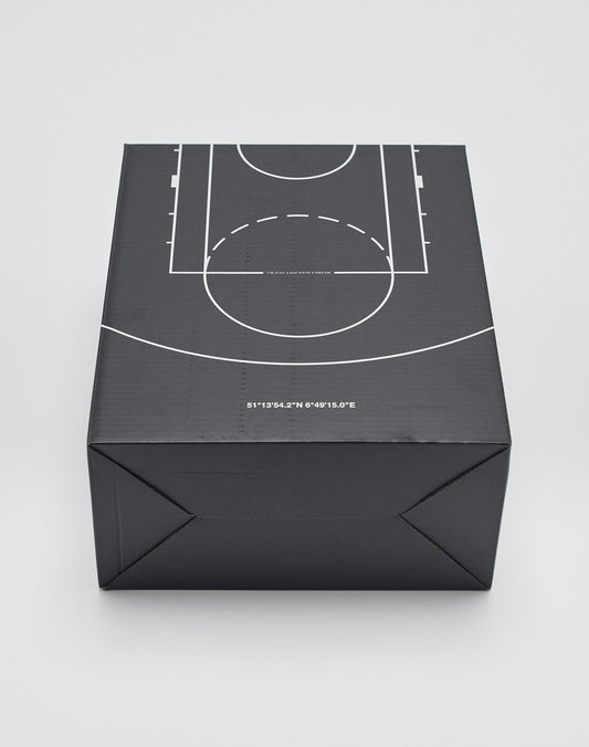 A black Live Fast Basketball box by LIVE FAST DIE YOUNG features a white court diagram on top and geographic coordinates along the front edge, displayed against a plain light background.