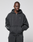 A person wearing the LIVE FAST DIE YOUNG LFDY Run Club Hooded Zip with chest LFTY text, Ärmelprint details, and matching oversized sweatpants stands with hands in pockets against a plain light gray background.