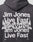 A person wearing the LIVE FAST DIE YOUNG Live Fast NY Hooded, an oversize dark hoodie crafted from soft Baumwolle and Polyester, featuring bold white Jim Jones Live Fast text and large silver graffiti-style New York lettering on the back.