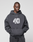 A person wearing the LFDY 40 Hooded by LIVE FAST DIE YOUNG, featuring a dark gray oversize fit with a white "40" and tiger graphic plus cozy Kangaroo-Tasche, stands against a plain light background.
