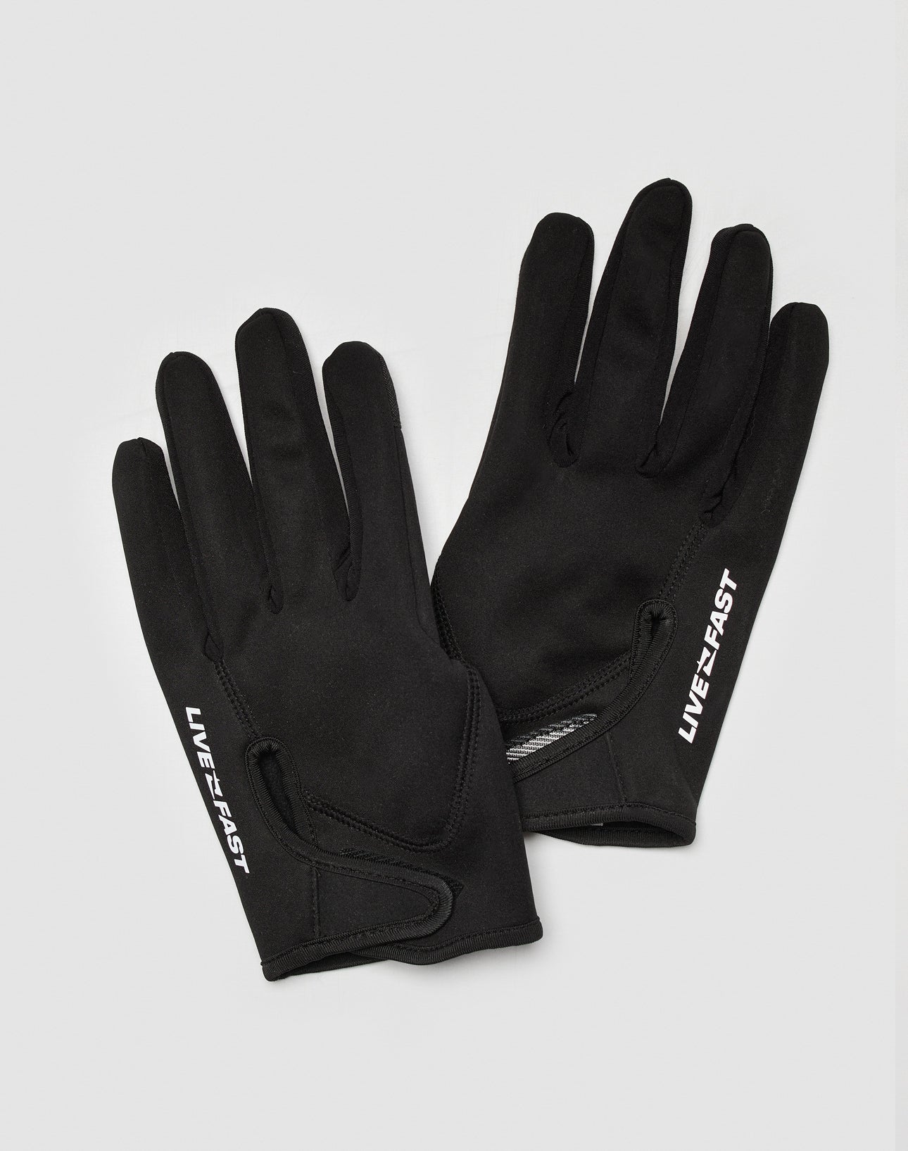 The LIVE FAST DIE YOUNG Live Fast Gloves are black touchscreen gloves featuring “LIVE FAST” in reflective print on top, ideal for smartphones and shown on a light gray background.