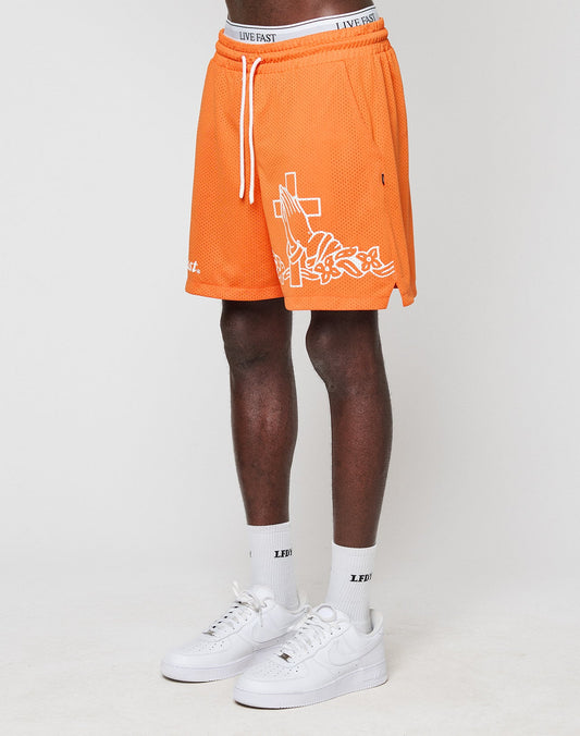 A person wearing LIVE FAST DIE YOUNG LFDY Praying Mesh Shorts in orange with white graphics, white socks, and Nike Air Force 1 sneakers stands against a plain white background. Only the lower half of the body is visible. | model