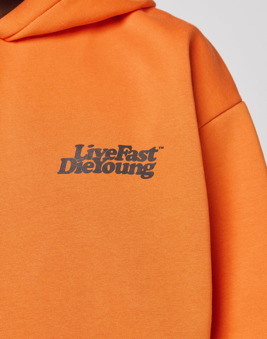 The Basic Orange Hooded by LIVE FAST DIE YOUNG is crafted from soft Baumwolle and features a bold black Live Fast Die Young slogan on the front.