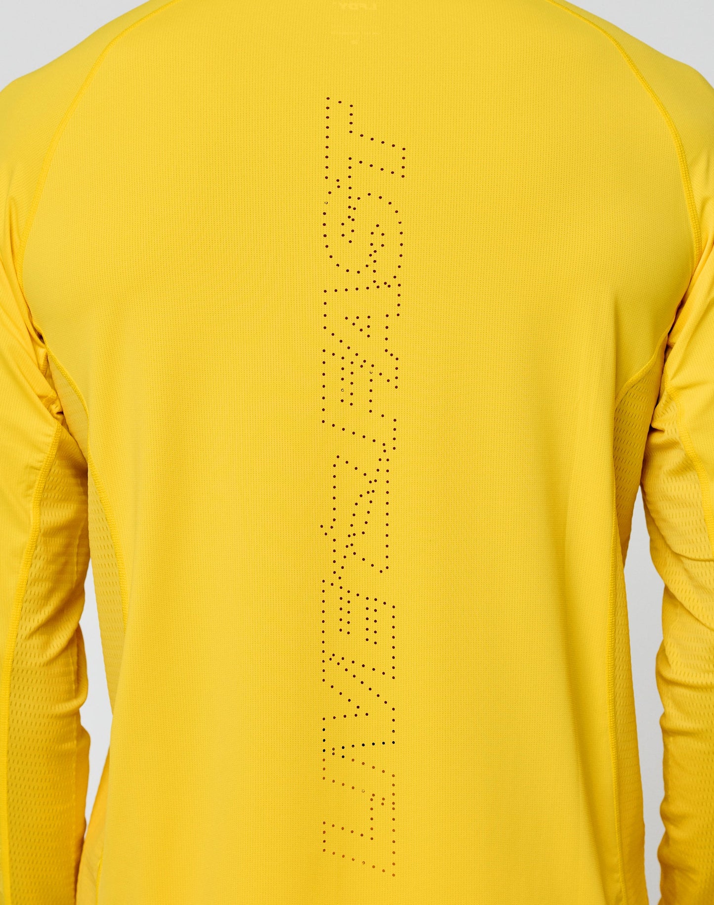 A person wears the LIVE FAST DIE YOUNG Live Fast Performance Longsleeve in bright yellow, featuring slim fit, vertical “LIVERFAST” perforations on the back, and a subtle mesh insert for breathability and modern style.