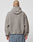 A person with a shaved head and a tattoo wears the LIVE FAST DIE YOUNG LFDY Teddy Hooded jacket, featuring an oversized fit and Eingrifftaschen, paired with denim pants, standing with their back to a plain white background.