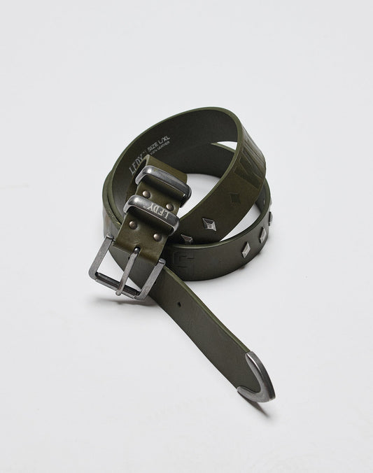 The LFDY Signature Belt by LIVE FAST DIE YOUNG, in olive green with a shiny metal buckle and metal studs, is shown rolled up on a white surface.| plain 