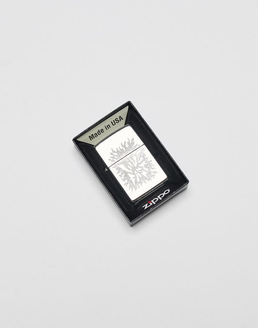 A silver LFDY x Zippo by LIVE FAST DIE YOUNG, featuring an engraved tree and aluminum case, is shown in a black box marked Made in USA against a white background.