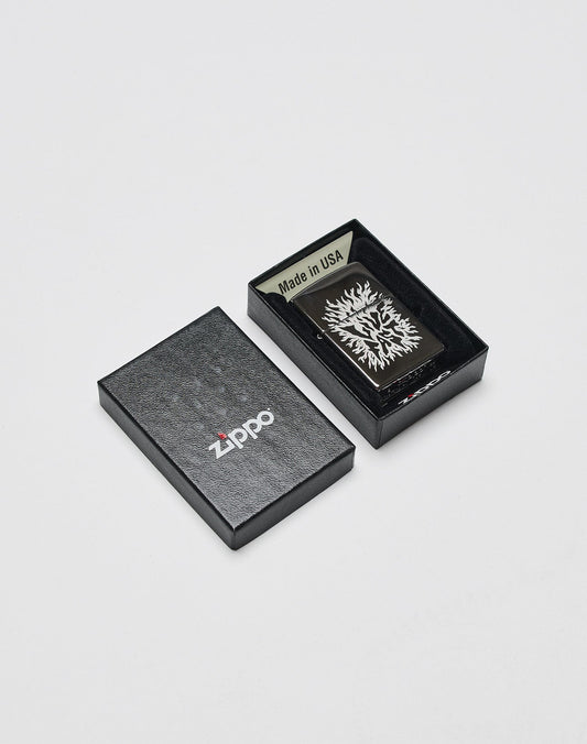 A black Zippo box, partly open, displays the LFDY x Zippo by LIVE FAST DIE YOUNG—Limited Edition Feuerzeug with tree design and Made in USA label inside its aluminium case on a plain white background.