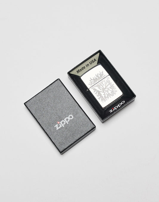 The LFDY x Zippo lighter by LIVE FAST DIE YOUNG features a silver aluminum case with an engraved tree design, displayed in an open black “zippo” box with the lid beside it and a “Made in USA” label inside.
