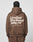A person with braided hair, seen from behind, wears a brown Basic 360 Hooded hoodie by LIVE FAST DIE YOUNG. Bold white text and smaller print are on the back. The hoodie, made from a cotton-poly blend, is paired with matching brown pants.