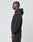 A person stands in profile, facing left, wearing the LIVE FAST DIE YOUNG Basic 510 Hooded Zip in Oversize Fit with matching black pants against a plain light gray background.
