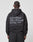 Seen from behind, a person with braided hair wears the LIVE FAST DIE YOUNG Basic 510 Hooded Zip in an oversized fit, featuring bold “Live Fast Hvy Sweat 510g/m²” text plus smaller details on a plain light background.