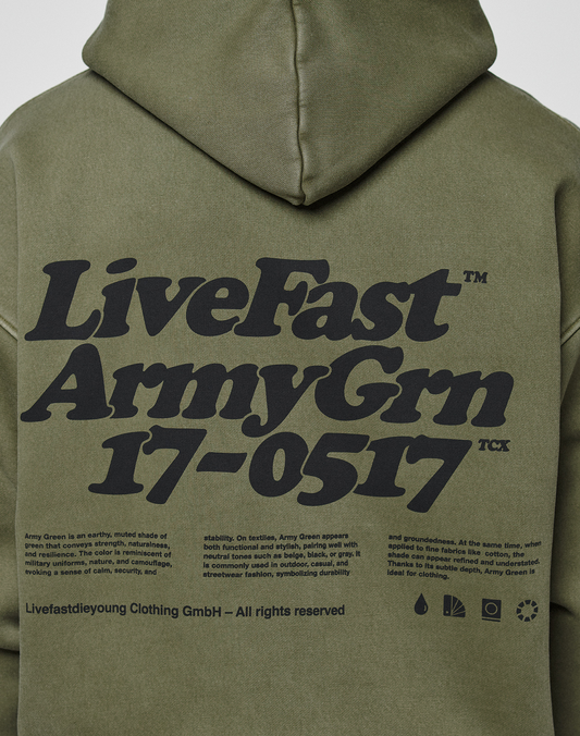 Back view of the LIVE FAST DIE YOUNG Basic 360 Hooded in olive green, oversize fit, bold black “LiveFast ArmyGrn 17-0517” text, smaller description below, topstitching, and icons with company info at the bottom.