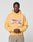 A man stands against a plain background wearing the LFDY Corp. Hooded by LIVE FAST DIE YOUNG, featuring a bold "Live Fast" front print in an oversize fit, paired with tan pants. His hands are clasped as he looks directly at the camera.