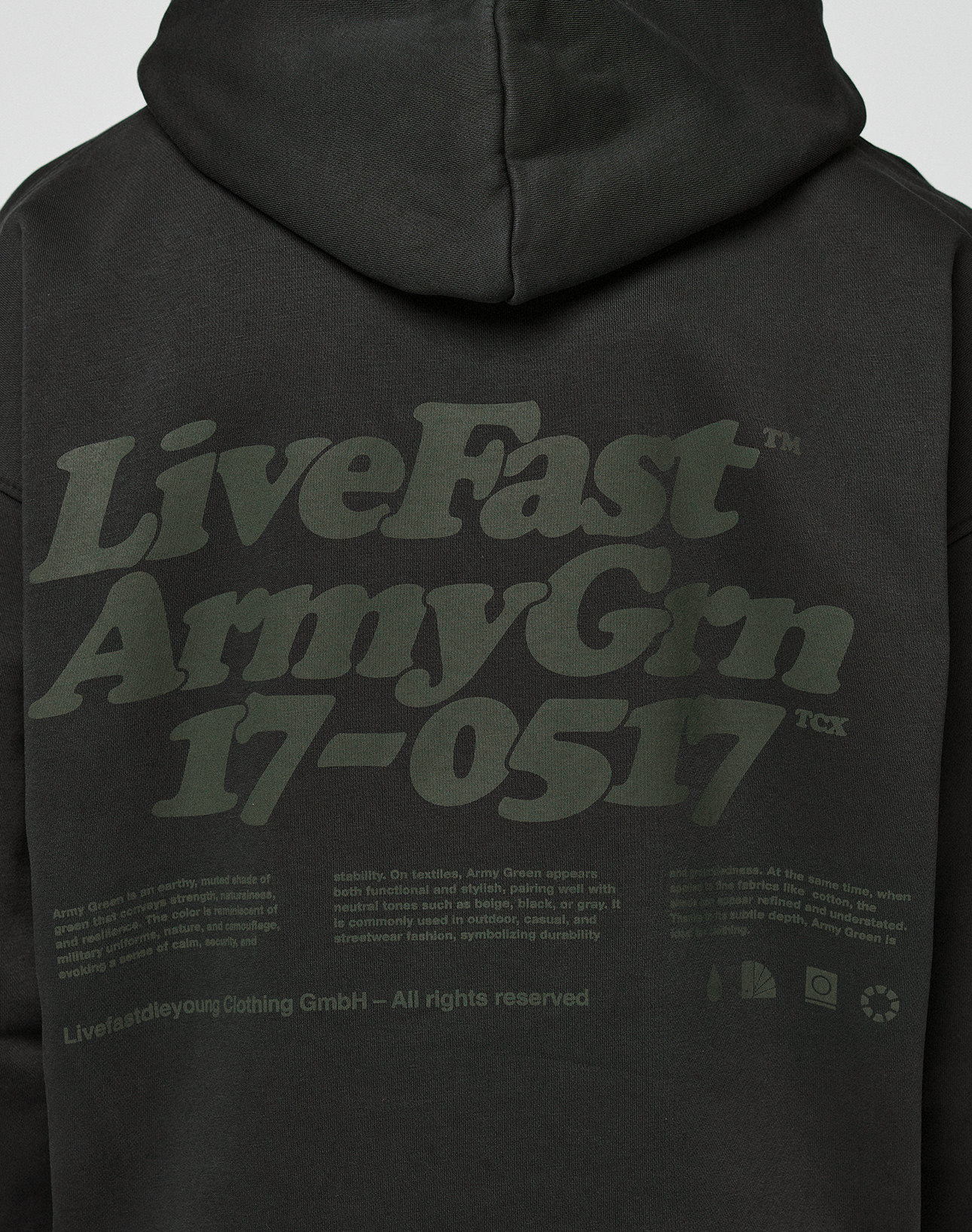The Basic 360 Hooded by LIVE FAST DIE YOUNG is an oversized black hoodie with green “LiveFast Army Grn 17–0517” text, front and back prints, care symbols, and branding. Made from premium cotton.