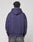 Someone is seen from behind, wearing the LIVE FAST DIE YOUNG Live Fast Stallion Hooded in purple (Oversize Fit) and faded gray jeans, set against a plain light gray background.