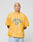 A person with short blond hair wears the LIVE FAST DIE YOUNG LFDY Boxy Jersey—a yellow, boxy mesh shirt with LIVE FAST D(Y) in blue—standing against a plain light gray background with a neutral expression.