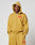 A person wears the LIVE FAST DIE YOUNG Live Fast Sweatsuit Jacket—an oversize fit mustard yellow zip-up hoodie with hood up, bold red front graphic, and LIVE FAST text—paired with matching sweatpants. Plain white background.