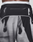 A close-up of the back of a person wearing LFDY Performance Shorts by LIVE FAST DIE YOUNG, featuring black and white abstract or animal print, a zipper pocket, "LIVE FAST" on the waistband, and a reflective logo print.