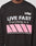 A person wears the LFDY Racing Longsleeve by LIVE FAST DIE YOUNG—an oversize black sweatshirt with LIVE FAST Everything in it. and LFDA above, plus pink diagonal stripes. Only the upper torso is visible. Made from 100% Baumwolle.