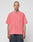 A person with a shaved head and tattoos wears the LIVE FAST DIE YOUNG Basic Evidence Tee in oversize faded pink, paired with dark pants, standing against a plain light gray background. The shirt is made from 100% Baumwolle.