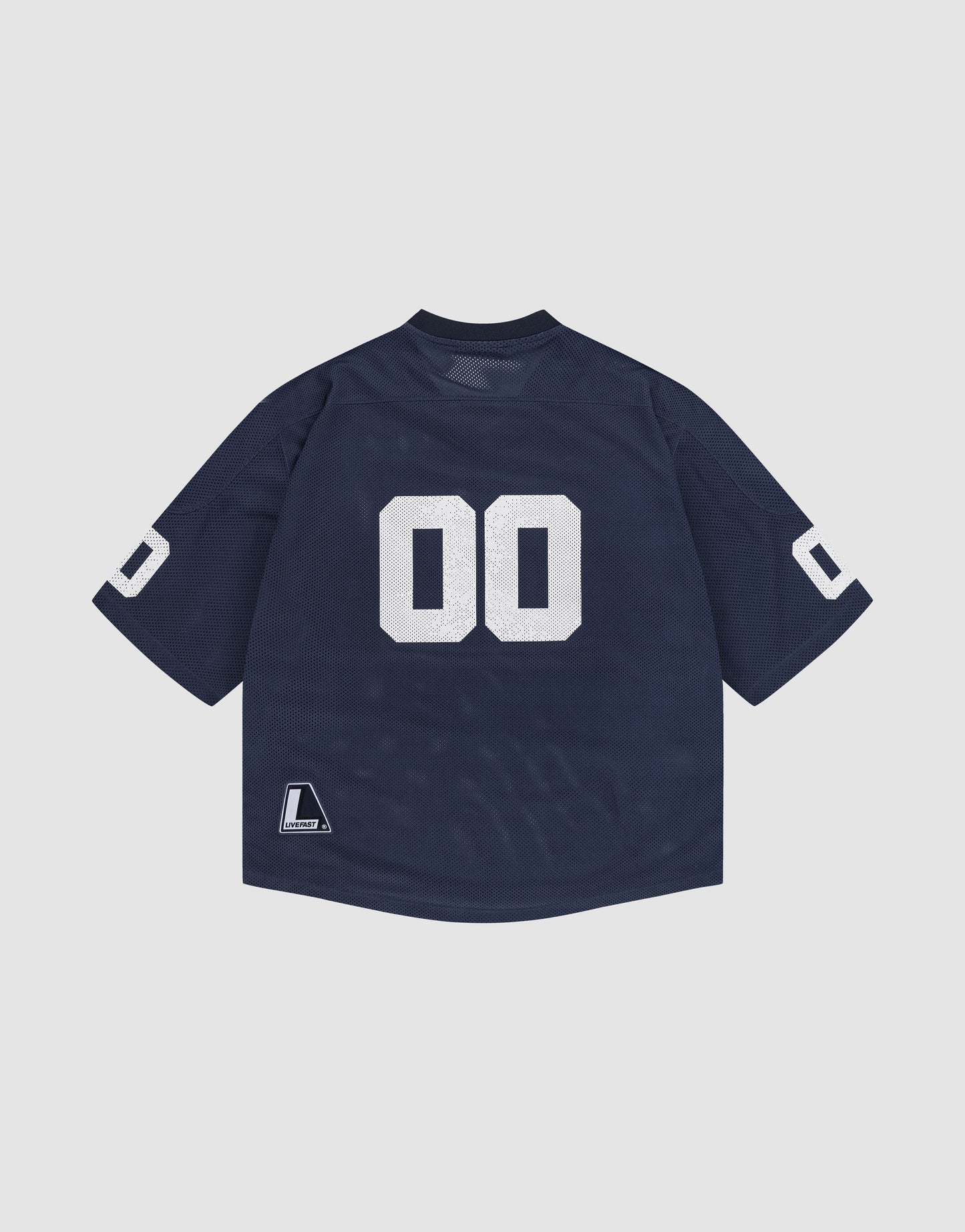 The LFDY Mesh Jersey by LIVE FAST DIE YOUNG is navy blue with white "00" block numbers on the back and sleeves, a V-neck, small rectangular label near the hem, and an oversize fit—all displayed on a light gray background.