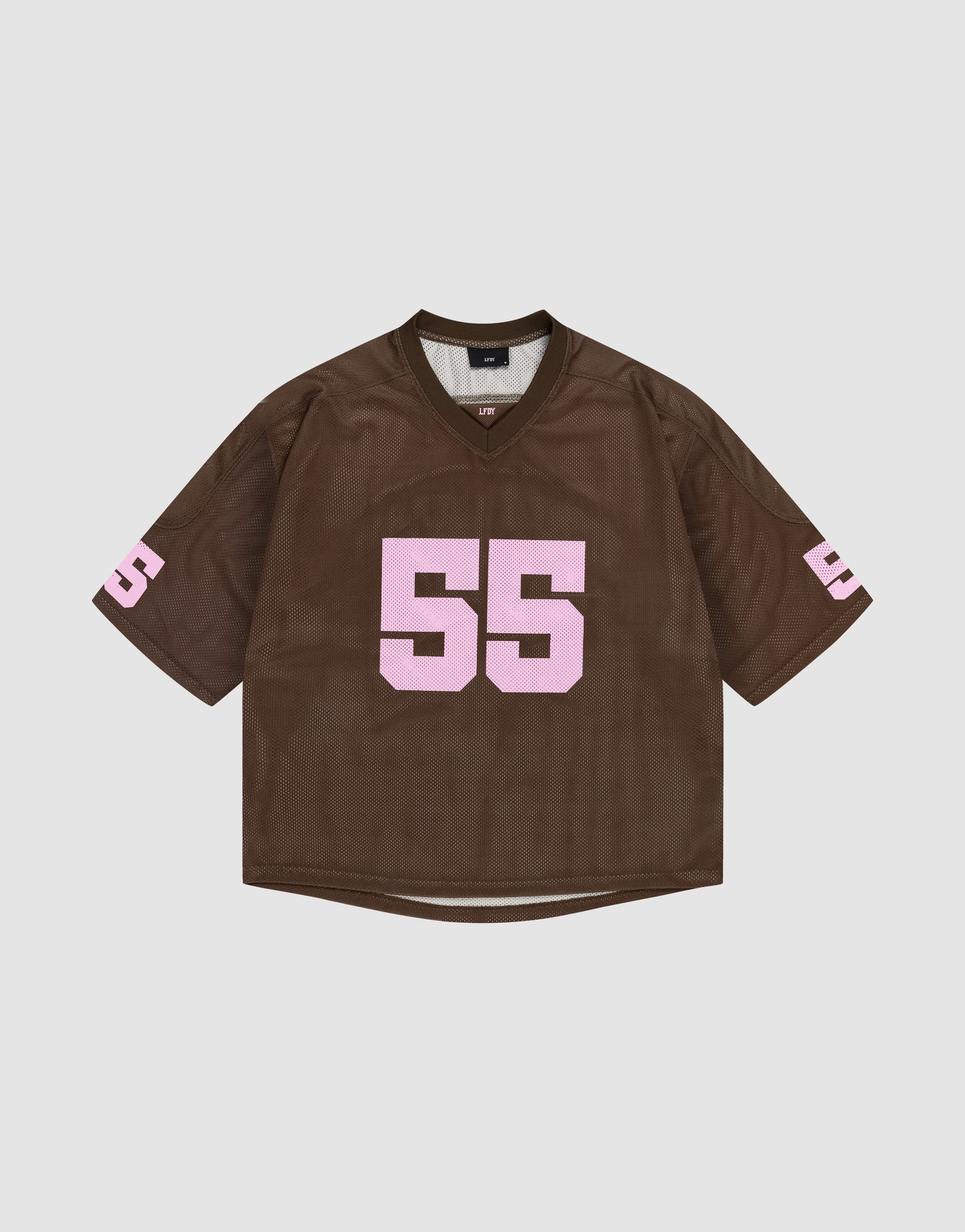 The LFDY Mesh Jersey by LIVE FAST DIE YOUNG is a brown polyester sports top with an oversized fit, showcasing the number 55 in bold pink print on the front and sleeves, shown against a plain white background.