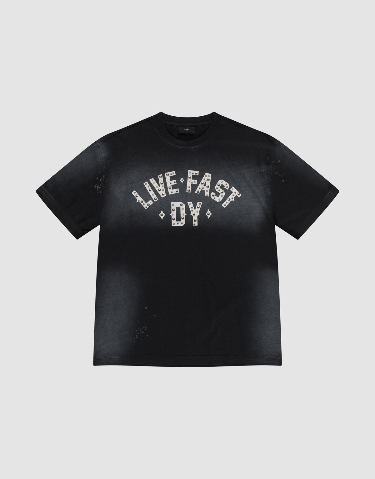 The Live Fast Rivet Tee by LIVE FAST DIE YOUNG is a black 100% Baumwolle shirt with a handgefertigter Sprayeffekt, faded finish, and bold "LIVE FAST DY" in white patterns across the chest. Displayed flat on a light gray background. | plain