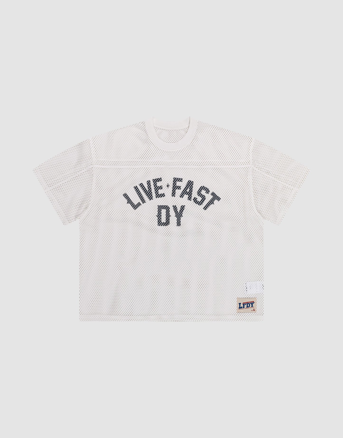 The LFDY Boxy Jersey by LIVE FAST DIE YOUNG features a white mesh, boxy fit, short sleeves, bold black "LIVE FAST DY" lettering on the front, and a small LFDY patch near the hem. Made from 100% polyester for comfort and durability.
