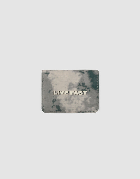 The LFDY Cardholder by LIVE FAST DIE YOUNG is a small, square wallet with a gray and black tie-dye design, Kartenfächer, and LIVE FAST in bold white letters on the front, shown against a plain light background.| plain 