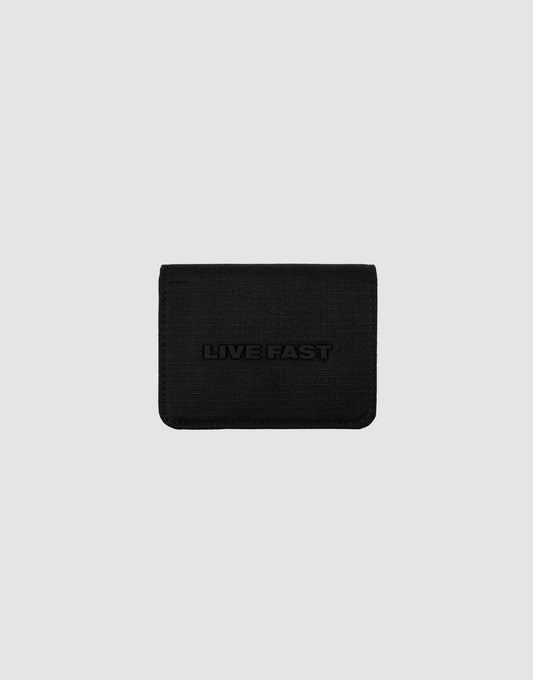 A black LFDY Cardholder by LIVE FAST DIE YOUNG features a textured surface, card slots, and "LIVE FAST" embossed on the front, shown against a plain light gray background.| plain 