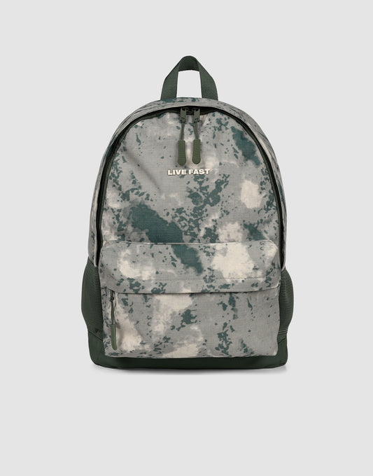 The LFDY Backpack by LIVE FAST DIE YOUNG is a gray-green camouflage 19L laptop rucksack with a large front pocket, black zippers, adjustable shoulder straps, and "LIVE FAST" printed near the top, shown against a plain light background.| plain 