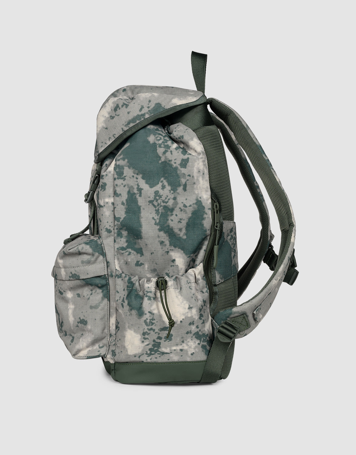 A side view of the LFDY Travel Backpack by LIVE FAST DIE YOUNG—a 25L laptop rucksack in green-gray camo, featuring adjustable shoulder straps, a zippered front pocket, and a top carry handle.