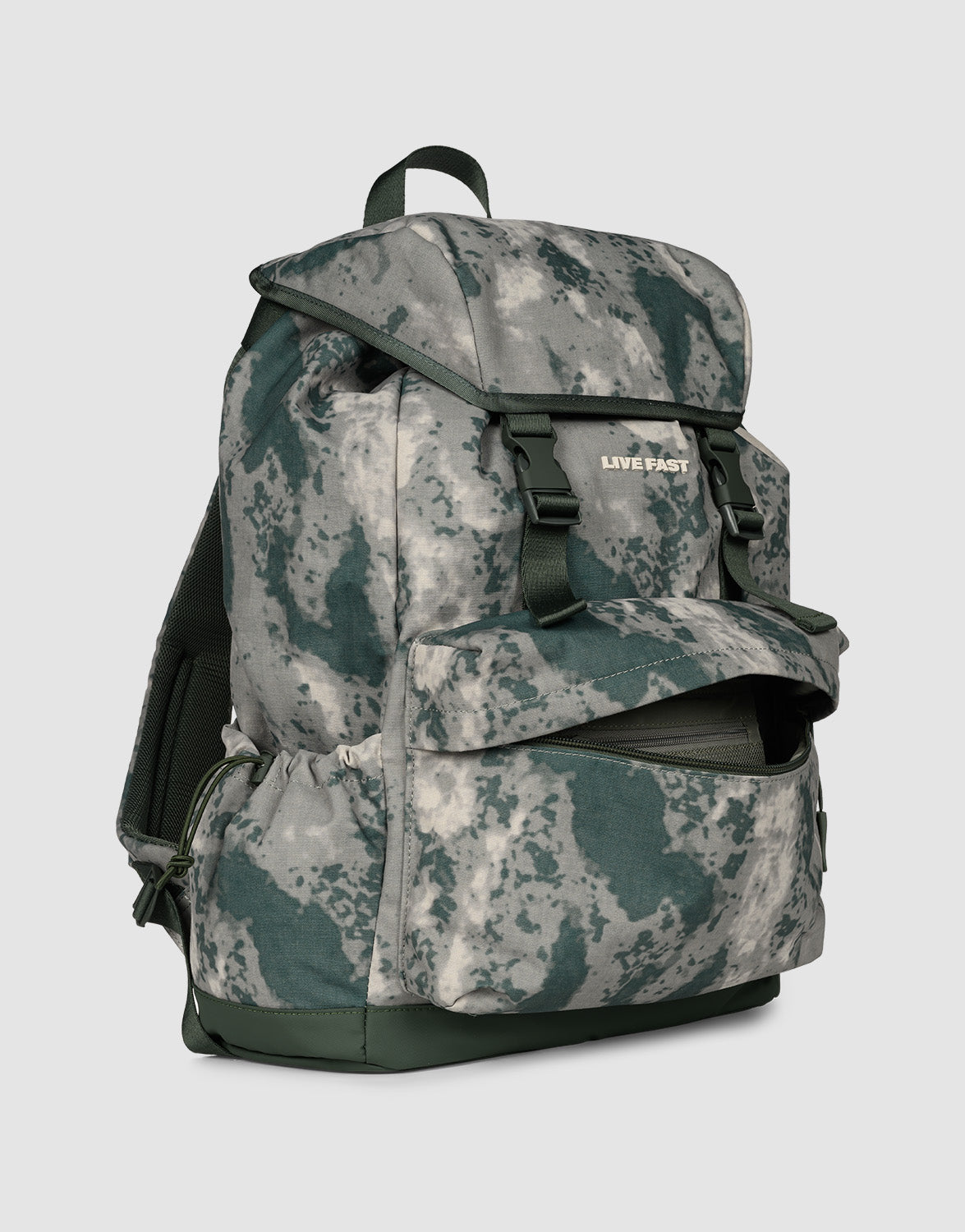 The LFDY Travel Backpack by LIVE FAST DIE YOUNG is a 25L green and gray camo rucksack with front and side pockets, adjustable shoulder straps, top flap closure, and the LIVE FAST brand name on the front.